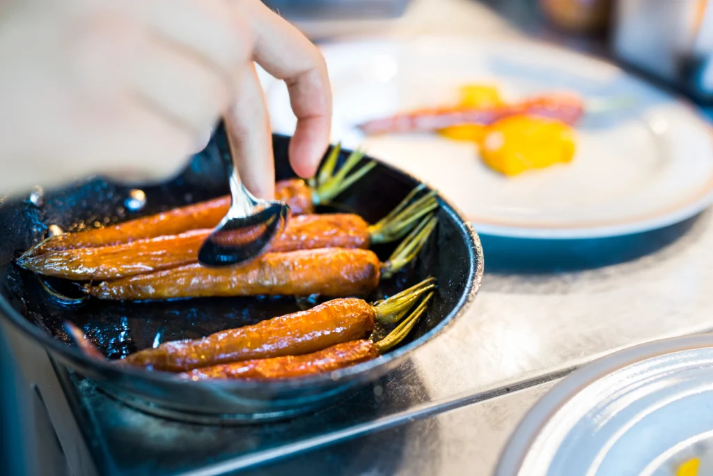 Melting carrots recipe served as a tender butter-glazed side dish with fresh herbs, perfect for a flavorful dinner accompaniment.