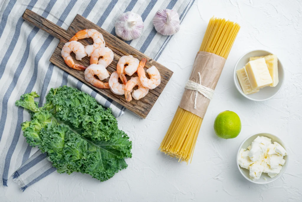 Garlic Butter Shrimp Pasta served with tender linguine, juicy sautéed shrimp, garlic butter sauce, fresh parsley, and grated Parmesan.