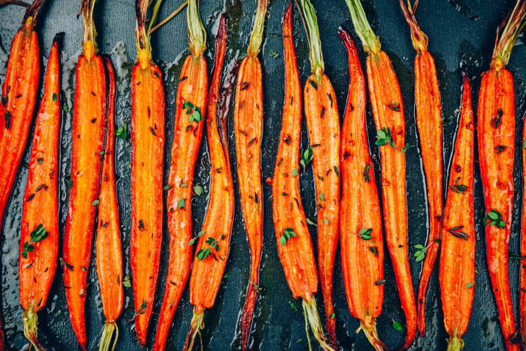 Melting carrots recipe served as a tender butter-glazed side dish with fresh herbs, perfect for a flavorful dinner accompaniment.