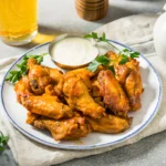 Crispy air fryer chicken wings with golden crunchy skin served with dipping sauce