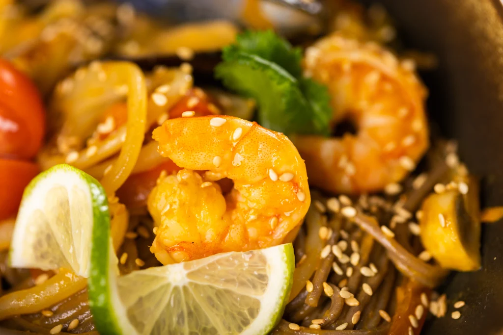 Thai Stir-Fried Shrimp with vegetables and jasmine rice served as an easy budget-friendly weeknight dinner.