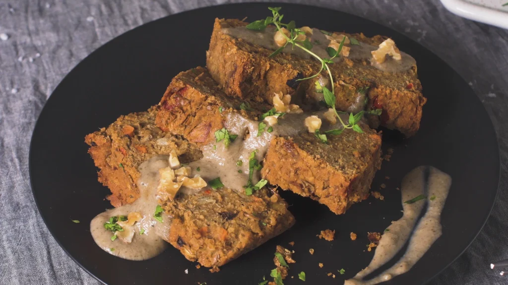 Crispy tofu with creamy peanut sauce served with rice and vegetables