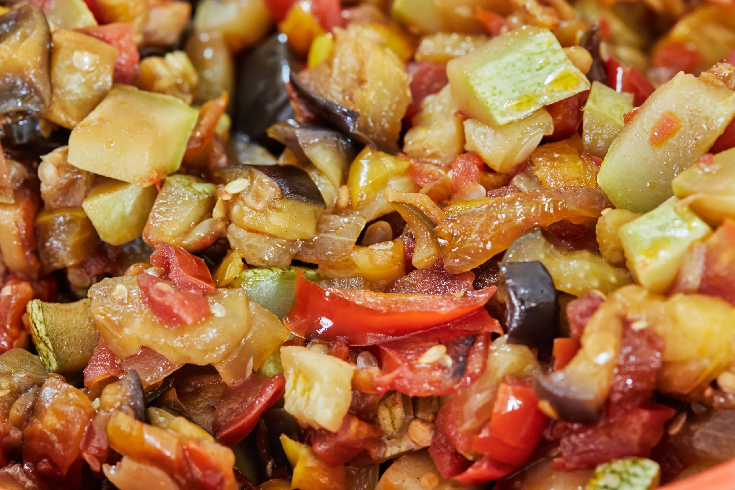 Sicilian caponata with eggplant, tomatoes, olives, and capers served as a sweet and sour Italian dish