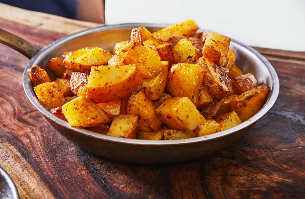 Crispy golden roast potatoes with fluffy centers and fresh herbs